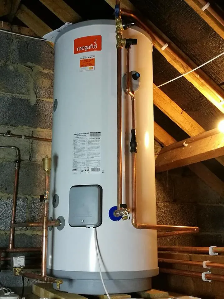 Unvented hot water cylinder installed in a loft space